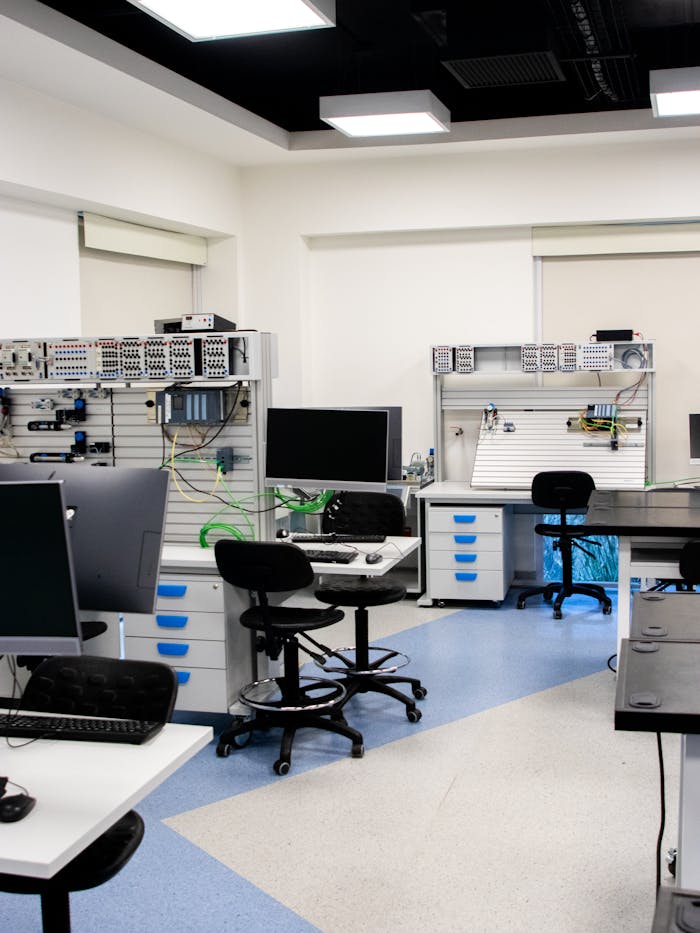 Bright and organized technology lab with computers and workstations, ideal for education or research.